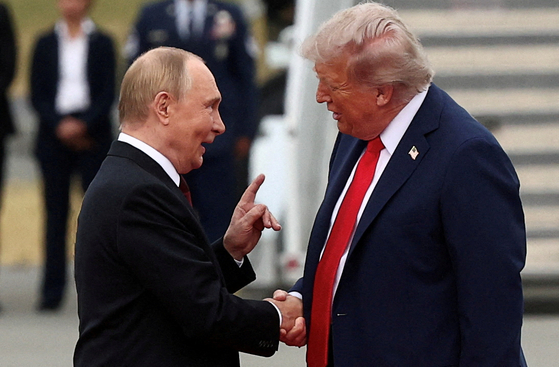 U.S. President Donald Trump shakes hand with Russian President Vladimir Putin as they meet to negotiate for an end to the war in Ukraine at Joint Base Elmendorf-Richardson in Anchorage, Alaska, on August 15. REUTERS/YONHAP