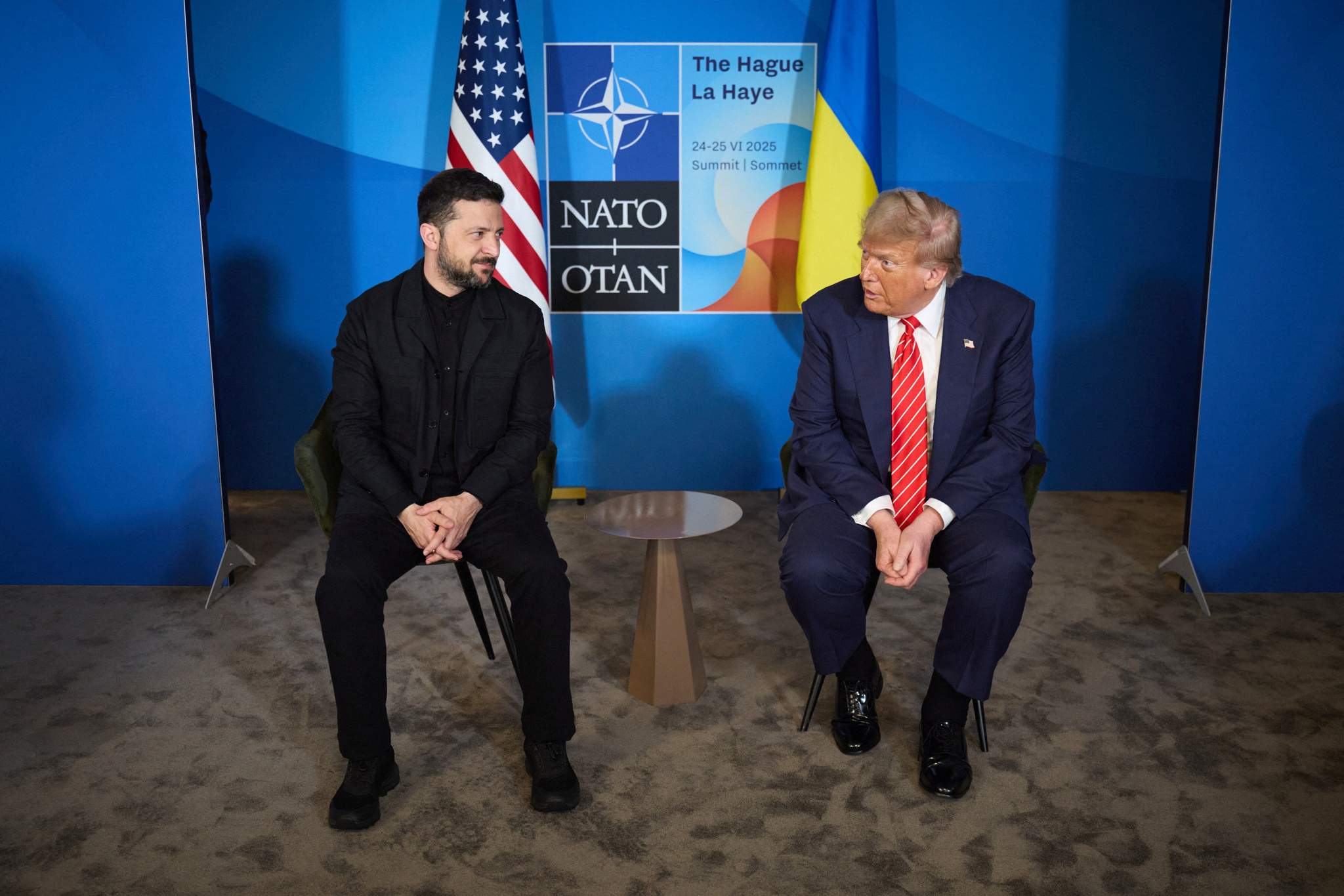 U.S. President Donald Trump, right, and Ukraine's President Volodymyr Zelensky attend a meeting on the sidelines of NATO summit in The Hague, Netherlands June 25. [REUTERS/YONHAP]