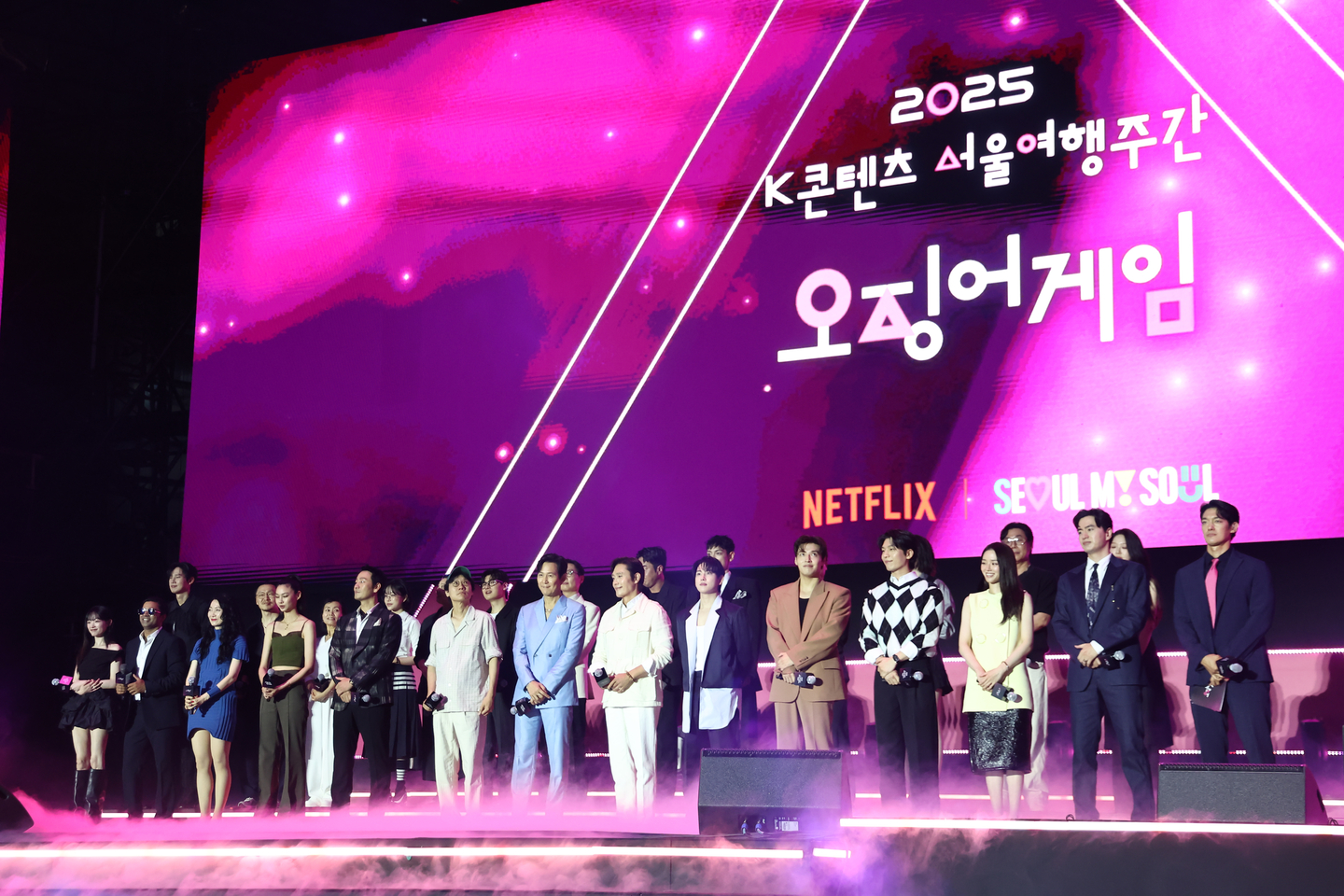 Producers and cast of the hit Netflix series ″Squid Games″ pose for photos during a fan event for season three of the series at Seoul Square in Jung District, central Seoul, on June 28. [YONHAP] 