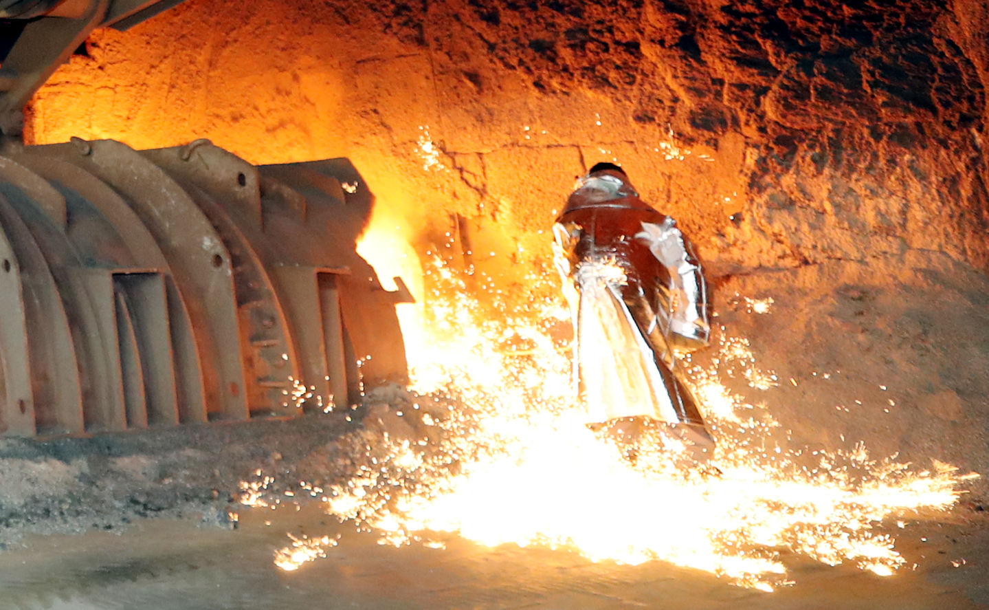 Workers handle molten metal at a blast furnace at Gwangyang Steelworks in Gwangyang, South Jeolla, on Aug. 7, 2024. [YONHAP] 