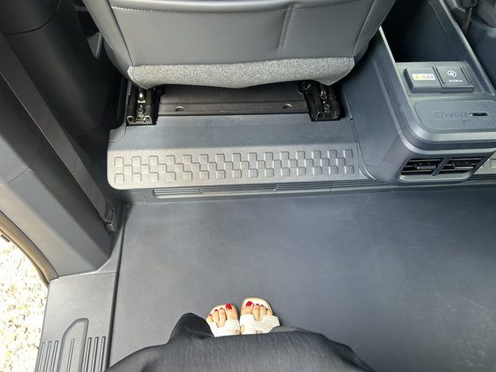  The passenger version of the PV5 touts a spacious second-row seat, with flat, hard flooring. [SARAH CHEA]