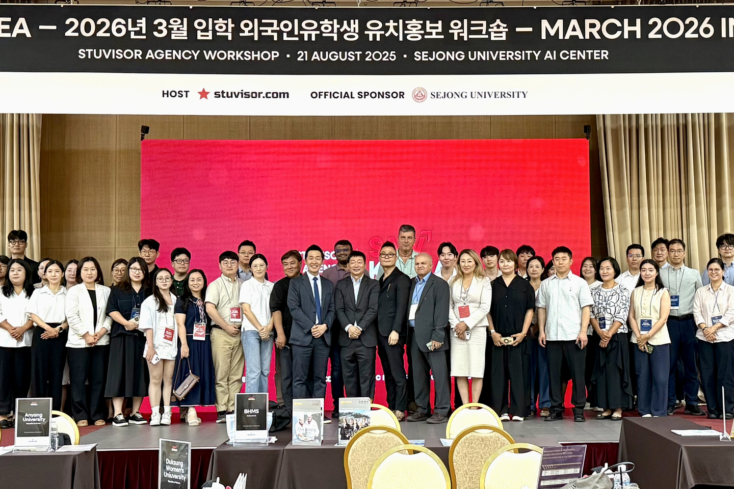 Education agents and university officials pose for a group photo at Sejong University’s AI Center in Gwangjin District, eastern Seoul, on Aug. 21. [YOON SEUNG-JIN]