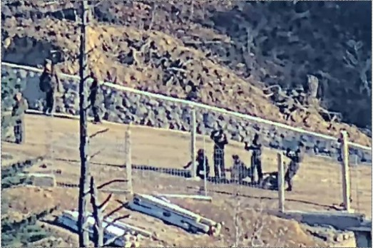 North Korean soldiers install barbed wire fences in a border area on Dec. 23, 2024. [JOINT CHIEFS OF STAFF]