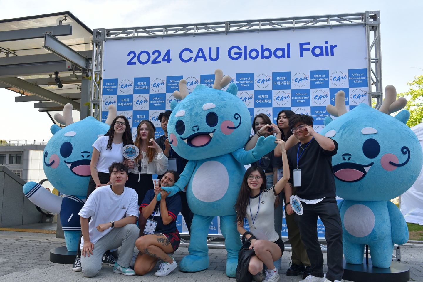 Students take a photo with Chung-Ang University's mascot Puang while enjoying the Global Fair held on May 9 and 10, 2024. [CHUNG-ANG UNIVERSITY]