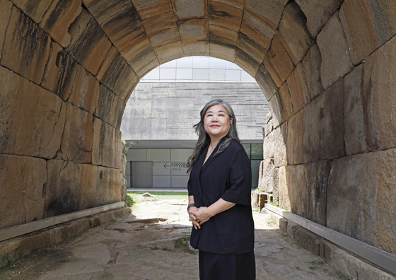 Curator Cho Hye-young poses for photos at Dongdaemun Design Plaza in Jung District, central Seoul, on Aug. 30. [PARK SANG-MOON]