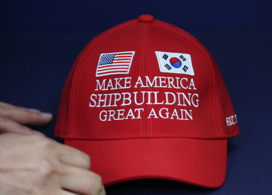 A "MASGA" baseball cap is seen in this photo released by the presidential office on Aug. 3. The slogan was created by Seoul's Ministry of Trade, Industry and Energy to concisely convey the goal of cooperation in the shipbuilding sector during the recent Korea-U.S. tariff negotiations, and the Korean negotiating team prepared this hat and a large panel for presentations during the talks. [YONHAP]