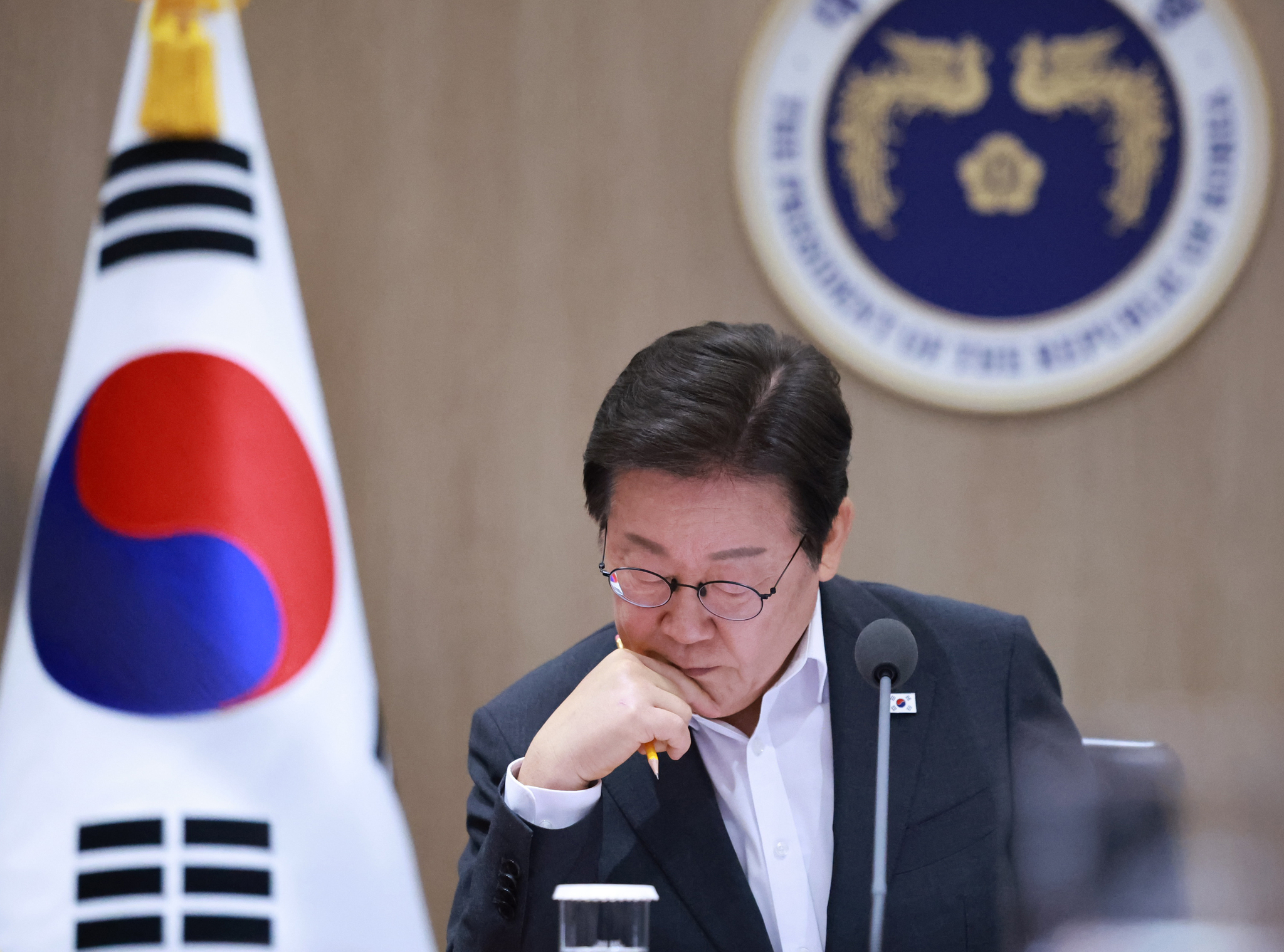 President Lee Jae Myung listens to Minister of Employment and Labor Kim Young-hoon discuss industrial safety measures during a Cabinet meeting at the presidential office in Yongsan District, central Seoul, on July 29. [YONHAP]