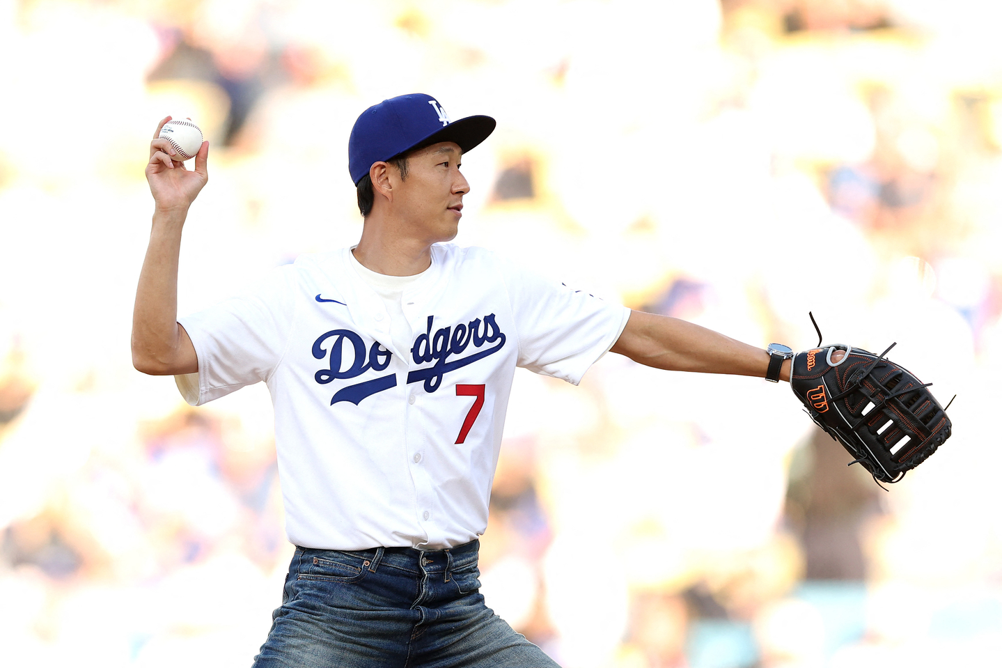 Los Angeles FC forward Son Heung-min throws the ceremonial first pitch before the game between the Los Angeles Dodgers and the Cincinnati Reds at Dodger Stadium on Aug. 27 in Los Angeles. [AFP/YONHAP]