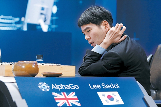 Korean Go grandmaster Lee Se-dol competes against Google DeepMind's AlphaGo at Four Seasons Hotel Seoul in Jung District, central Seoul, on March 12, 2016. [GOOGLE]