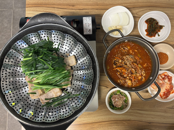 Suyuk (boiled pork belly) and nakji bbokkeum (spicy stir-fried octopus) at Korean diner Sigoljib [LEE JIAN]