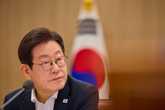 President Lee Jae Myung listens during a meeting on saving national finances at the presidential office in Yongsan District, central Seoul, on Aug. 13. [NEWS1] 