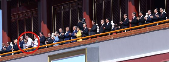 World leaders watch a military parade at Tiananmen Square in Beijing, China, on Sept. 3, 2015, to commemorate the 70th anniversary of China's Victory Day. Nikolai Lukashenko, circled in red, the third son of Belarusian President Alexander Lukashenko, is seen on the ramparts. [JOINT PRESS CORPS]