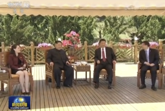 North Korean leader Kim Jong-un and Chinese President Xi Jinping meet in Dalian, China, in May 2018 [SCREEN CAPTURE]