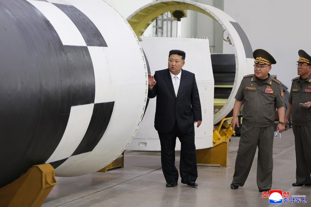 North Korean leader Kim Jong-un inspects a research institute for a new high-powered engine for intercontinental ballistic missiles on Sept. 1, the day Kim departed for Beijing to attend China's military parade. [KCNA]