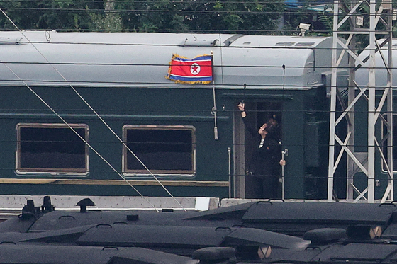 A North Korean flag flutters from a train believed to be carrying North Korean leader Kim Jong-un as it arrives in Beijing on Sept. 2. The North Korean leader is expected to attend a military parade in Beijing on Wednesday to mark the 80th anniversary of the end of World War II. [REUTERS/YONHAP]