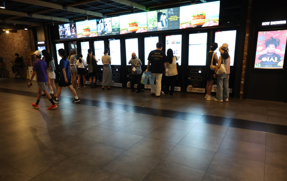 Visitors are seen at a cinema theater in Seoul on Aug. 8. [NEWS1]