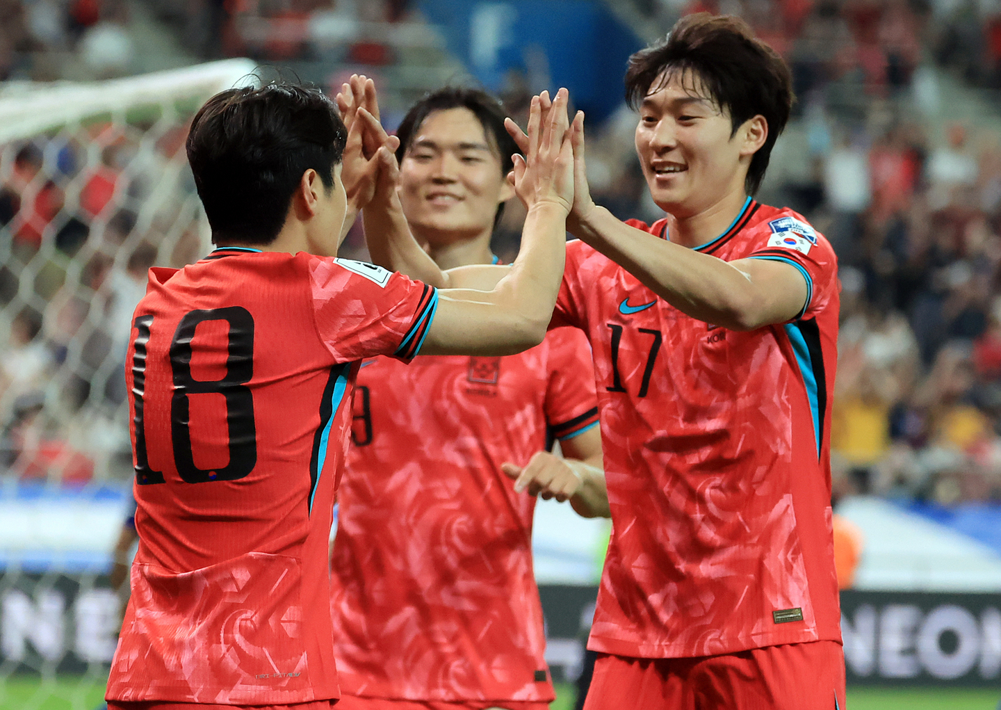 From left, Lee Kang-in, Oh Hyeon-gyu and Bae Jun-ho celebrate after scoring a goal against Kuwait in a 2026 FIFA World Cup qualifier on June 10. [NEWS1]