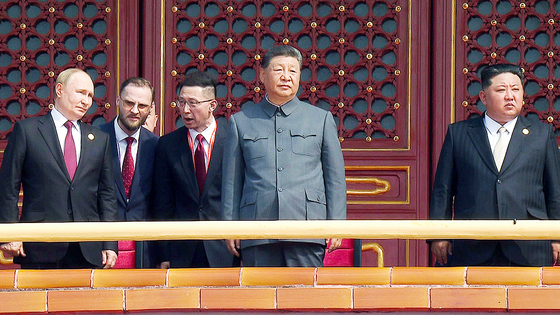 North Korean leader Kim Jong-un, far right, stands next to Chinese President Xi Jinping during the Victory Day military parade held in Beijing on Sept. 3. [NEWS1] 