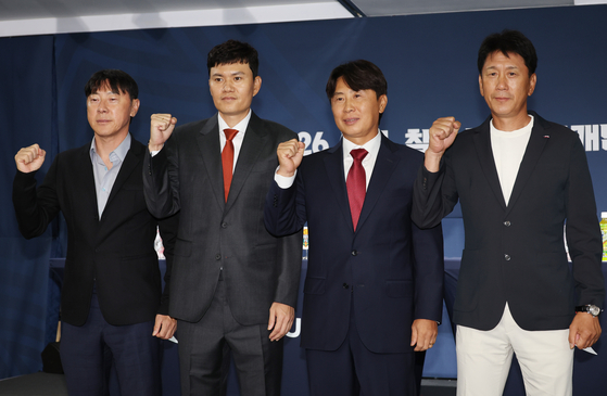 Head coaches of the four K League 1 clubs set to compete at the 2025-2026 Asian Football Confederation Champions League tournaments pose for photos before their joint press conference at the Korea Football Association House in Seoul on Sept. 4. From left: Shin Tae-yong of Ulsan HD FC, Chung Kyung-ho of Gangwon FC, Kim Gi-dong of FC Seoul and Park Tae-ha of the Pohang Steelers. [YONHAP]