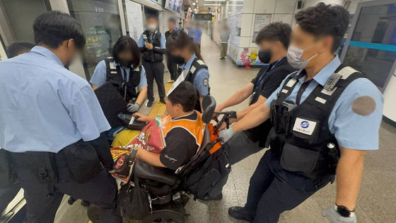 Members of Solidarity Against Disability Discrimination hold a protest at Myeong-dong Station on subway Line No. 4 on Sept. 5. [SOLIDARITY AGAINST DISABILITY DISCRIMINATION]