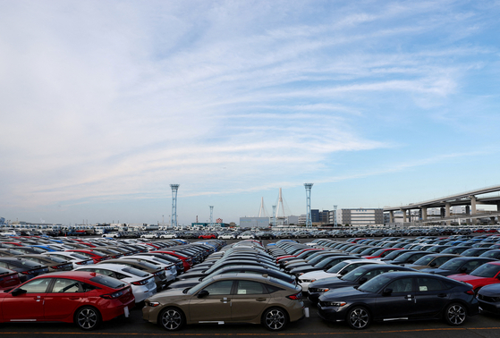 Honda Motor vehicles are lined up at a storage yard at an industrial port in Yokohama, Japan, on July 23. [REUTERS/YONHAP]