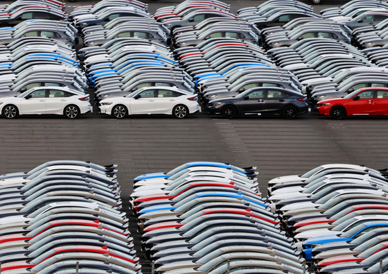 Honda Motor vehicles are lined up at a storage yard at an industrial port in Yokohama, Japan, on July 23. [REUTERS/YONHAP]