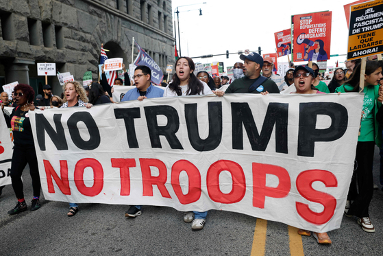 People participate in a demonstration against the planned deployment of National Guard troops in Chicago on Sept. 6. [AFP/YONHAP]