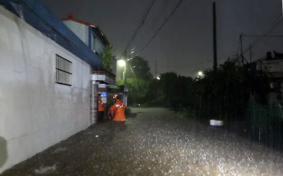 A firefighter is dispatched to a distress report from Gunsan, North Jeolla, as heavy rain hit the region in the early morning on Sept. 7. [JEONBUK FIRE DEPARTMENT]