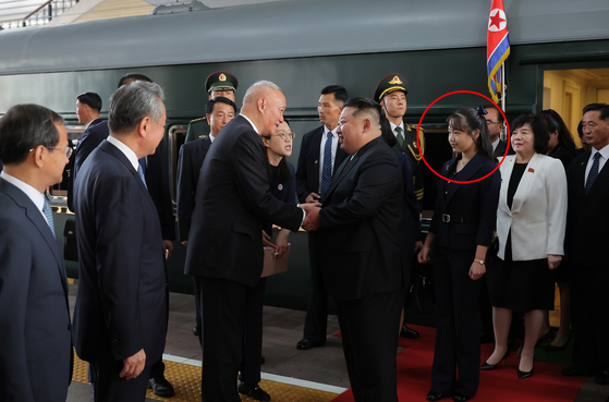 Kim Ju-ae, daughter of North Korean leader Kim Jong-un, is seen accompanying her father in Beijing on Sept. 2 in this photo provided by the Korean Central News Agency. [YONHAP] 