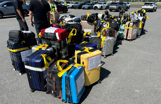 Personal belongings of workers who were kept in detention at the Immigration and Customs Enforcement (ICE) facility in Folkston, Georgia, are organized by staff at LG Energy Solution and Hyundai Motor Group on Sept. 9. [YONHAP]
