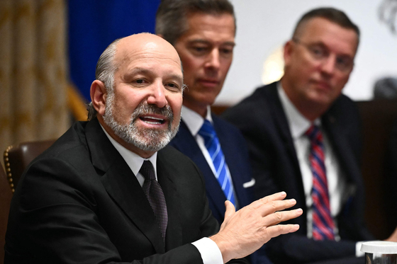 U.S. Secretary of Commerce Howard Lutnick, left, speaks during a cabinet meeting with U.S. President Donald Trump in the Cabinet Room of the White House in Washington, DC, on Aug. 26. [AFP/YONHAP] 