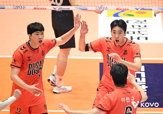 Busan OK Savings Bank OKman celebrate during a Korea Volleyball Federation Cup match against the Cheonan Hyundai Capital Skywalkers at Jinnam Gymnasium in Yeosu, South Jeolla on Sept. 13. [KOVO]