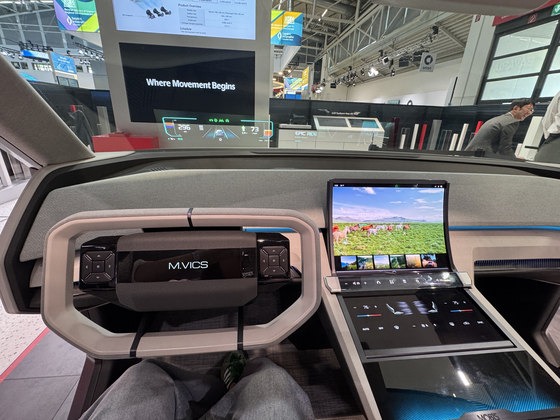 Hyundai Mobis' "holographic windshield display" turns the entire windshield into a massive heads-up display when drivers start the car. A mockup of a car equipped with the technology is on display at its booth at the IAA Mobility 2025 expo in Munich. [SARAH CHEA] 