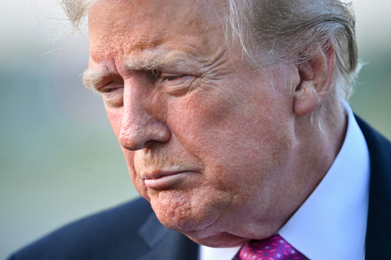 U.S. President Donald Trump speaks to members of the press before boarding Air Force One at Morristown Municipal Airport in Morristown, New Jersey, on Sept. 14. [AFP/YONHAP]