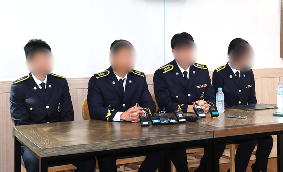 Four colleague of Lee Jae-seok, a Coast Guard officer who died while rescuing an older man trapped at a mud flat, hold a press conference at Lee's funeral home in Dong District, Incheon, on Sept. 15. The officers alleged that Coast Guard higher-ups tried to cover up the circumstances of Lee's death. [YONHAP]