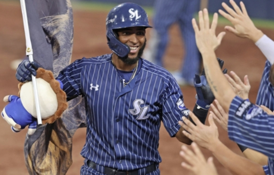 Lewin Diaz of the Samsung Lions is congratulated by teammates after hitting a solo home run against the KT Wiz during the clubs' KBO regular-season game at Daegu Samsung Lions Park in Daegu on Sept. 14. [SAMSUNG LIONS]