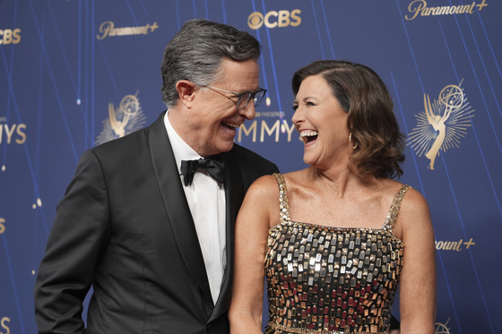 Stephen Colbert, left, and Evelyn McGee-Colbert arrive at the 77th Primetime Emmy Awards on Sept. 14, at the Peacock Theater in Los Angeles. [AP/YONHAP]