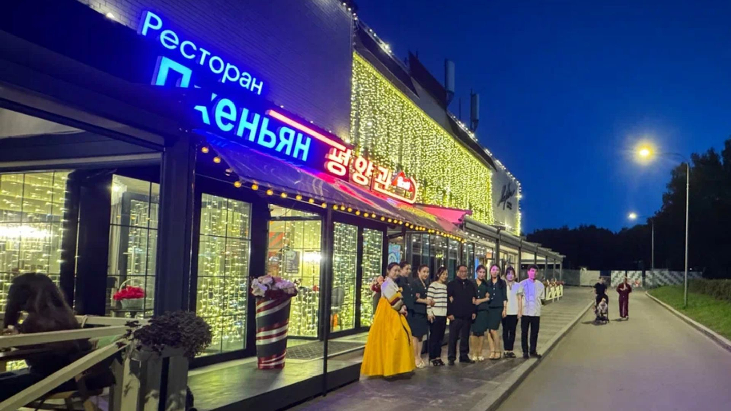 North Korean restaurant staff pose in front of the country's newly opened restaurant in Moscow. [SCREEN CAPTURE]