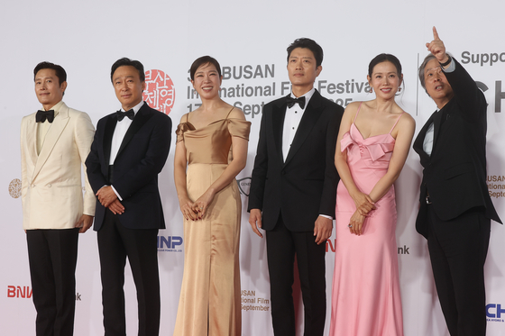 Cast members of the film "No Other Choice" and director Park Chan-wook, far right, pose for the red carpet at the opening ceremony of the Busan International Film Festival at the Busan Cinema Center in Haeundae District, Busan, on Sept. 17.