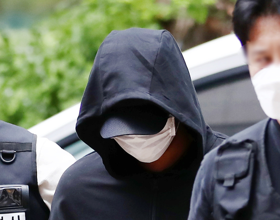 Inha University student Kim enters the Incheon District Court on July 17, 2022. Kim was found guilty of leading to the death of a female university student who fell after being sexually assaulted by him. [YONHAP]