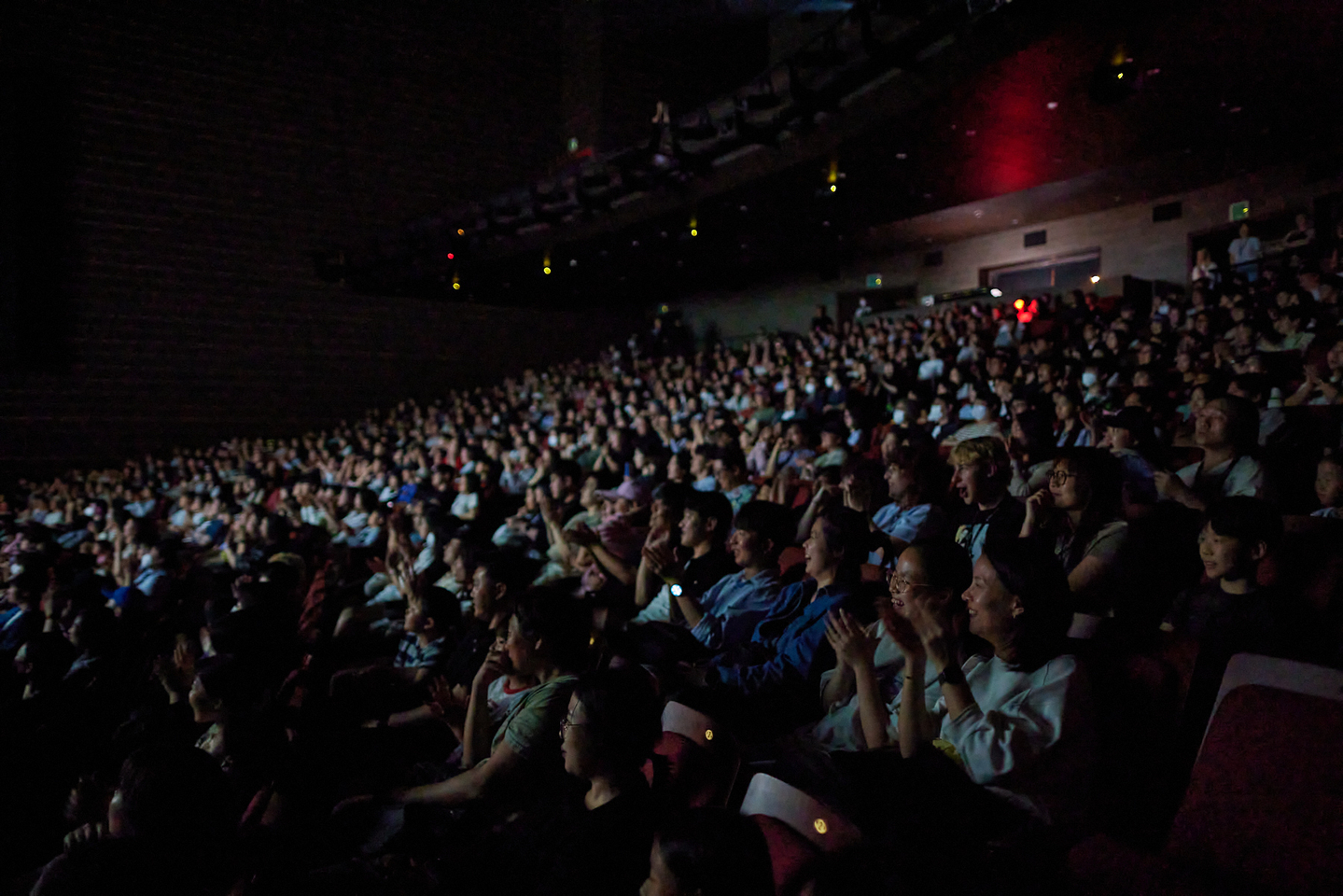 The audience watches Korea's first sing-along screening of Netflix's ″KPop Demon Hunters,″ held at Dongseo University Sohyang Theatre ShinhanCard Hall on Sept. 20. [BIFF]