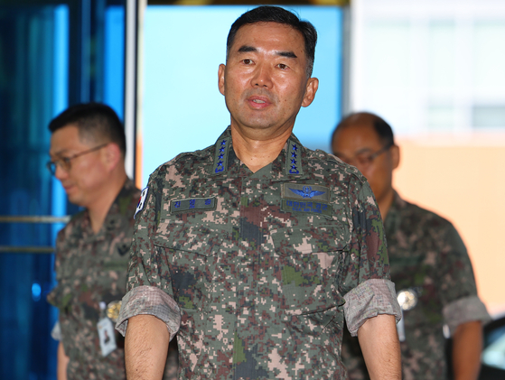 The nominee for the chairman of the Joint Chiefs of Staff, Air Force Lt. Gen. Jin Yong-sung, responds to questions from the press on his way to his office at the Ministry of National Defense compound in central Seoul ahead of a parliamentary confirmation hearing, in this picture taken on Sept. 4. [YONHAP]
