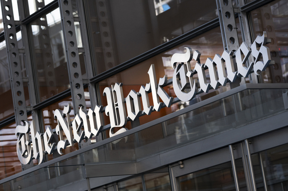 A sign for The New York Times hangs above the entrance to its building in New York May 6, 2021. [AP/YONHAP]