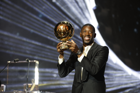 Paris Saint-Germain forward Ousmane Dembele poses with the Ballon d'Or trophy during the Ballon d'Or 2025 ceremony at the Theatre du Chatelet in Paris on Sept. 22. [EPA/YONHAP]
