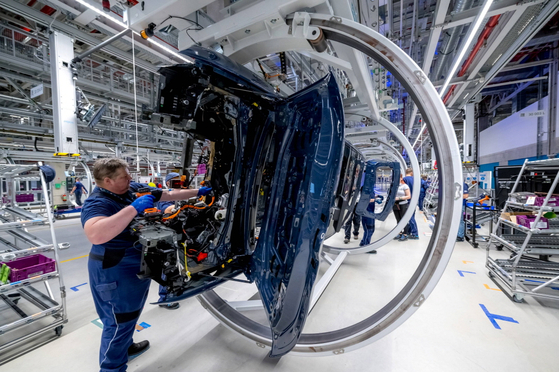 A worker assembles an iX3 at BMW's newest manufacturing plant in Debrecen, Hungary. Mass production starts in October. [BMW KOREA]