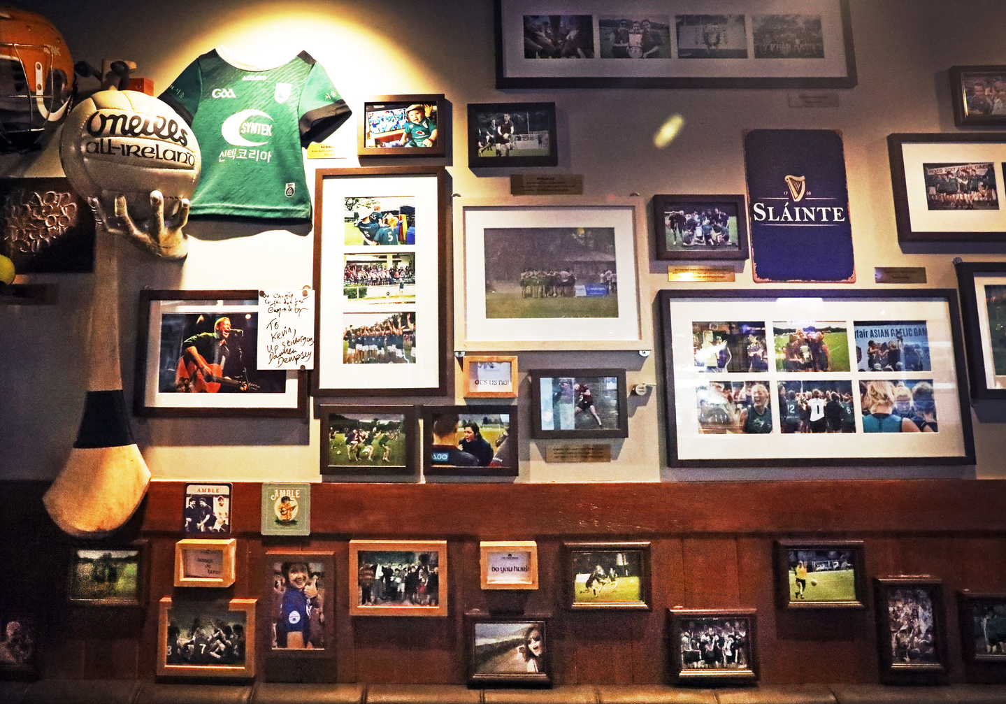 Frames of personal photos hang on the wall at the Irish pub The Craic House in Yongsan District, central Seoul [PARK SANG-MOON]
