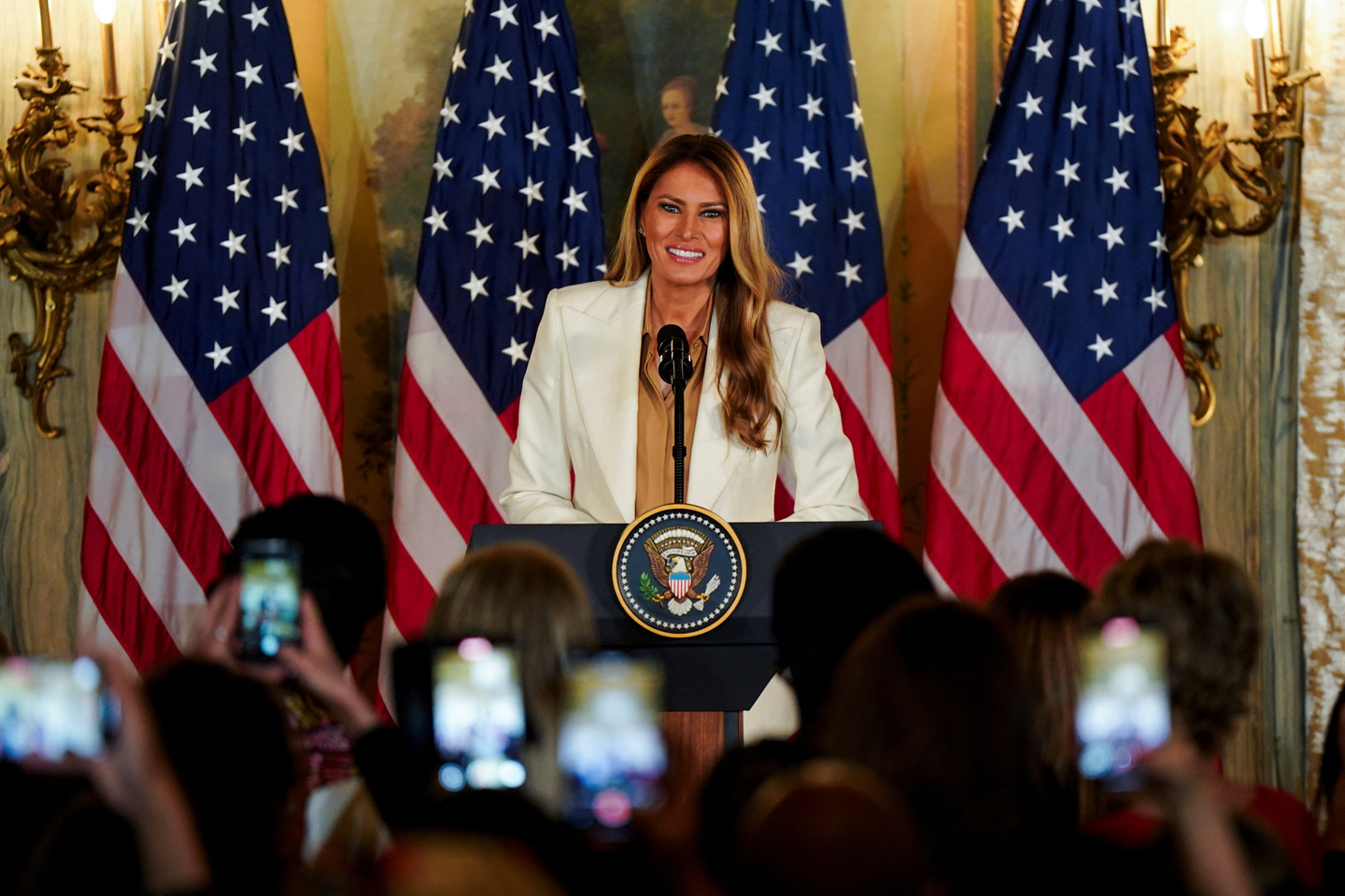 U.S. first lady Melania Trump addresses an audience of spouses of heads of government, including Korean first lady Kim Hea Kyung, as she announces her ″Fostering the Future Together″ initiative on the sidelines of the 80th United Nations General Assembly at the Lotte New York Palace Hotel in New York on Sept. 23. [REUTERS/YONHAP]