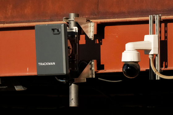 A Trackman device used for the Automated Ball-Strike System is posted on the balcony behind home plate before a spring training baseball game between the Kansas City Royals and the Los Angeles Dodgers, on Feb. 22, in Phoenix. [AP/YONHAP]