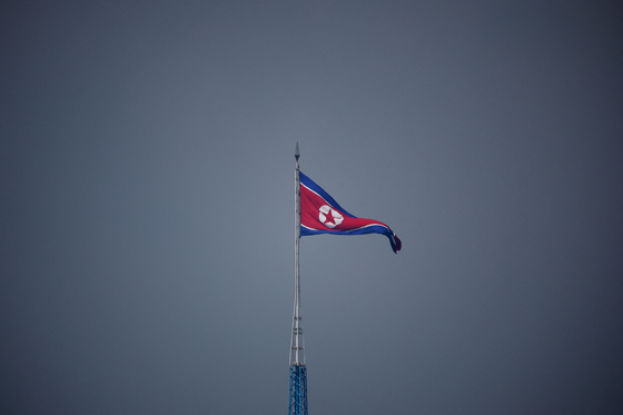 A North Korean flag flutters at the propaganda village of Gijungdong in North Korea, in this picture taken near the truce village of Panmunjom inside the demilitarized zone separating the two Koreas, South Korea on July 19, 2022. [REUTERS/YONHAP]