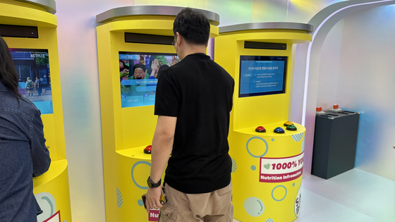 A person plays a game at the Saja Boys area in "Kpop Demon Hunters" zone. [WOO JI-WON]
